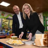 Michelle O’Neill pictured making toast with Sean Dillon, headmaster at Primate Dixon Primary School, during her visit to her former primary school. Credit: Submitted