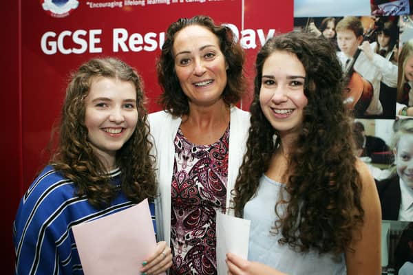 Pictured on GCSE results day 2018 at Ballyclare High School are Erin McWilliam and Zoe Black, with principal Dr Michelle Rainey.  Both topped the scores in Ballyclare with 10A* and 1A.   Photo: Freddie Parkinson