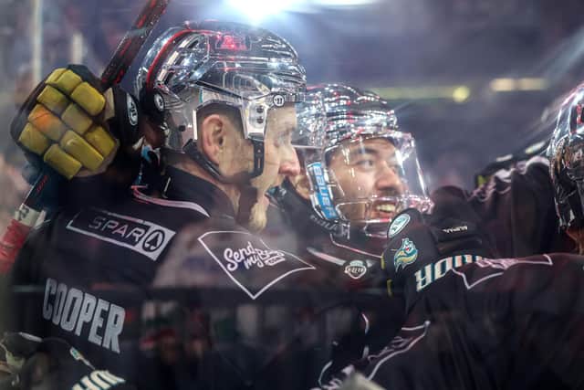 Belfast Giants’ Mark Cooper and Elijiah Barriga celebrate a goal against the Cardiff Devils during in the Challenge Cup final at the SSE Arena, Belfast. Photo by William Cherry/Presseye