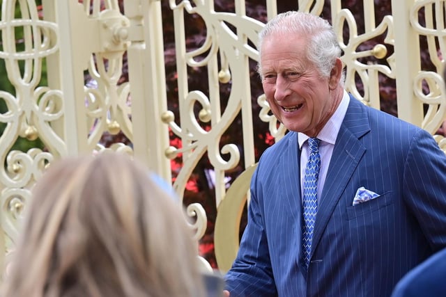 King Charles enjoying his visit to the coronation garden at Hazelbank Park. Picture Colm Lenaghan/Pacemaker