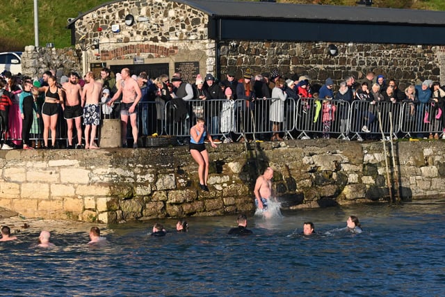 Leaping into 2024 at the annual New Year's Day swim in Carnlough.
