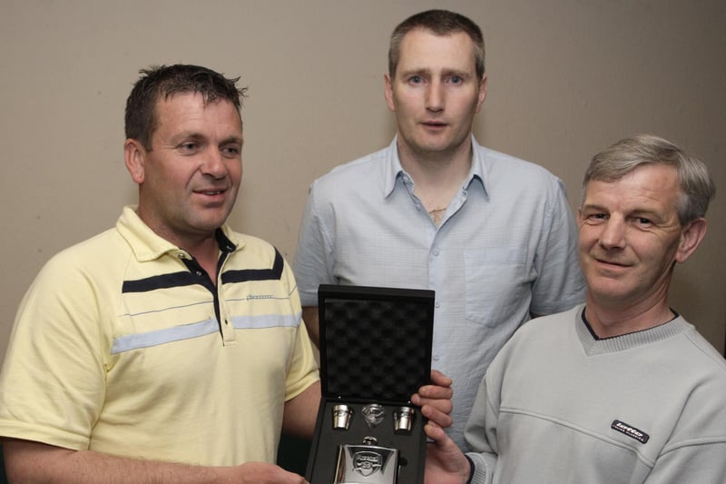 Gary Lyttle, who has left his post as Manager of the Taverners FC pictured at their presentation dinner in 2009 at the Bush Tavern receiving a gift from Danny Graham, who was presenting it on behalf of the players. Looking on is Sponsor, Craig Black