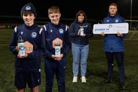 Bangor FC 2010 members with Power NI representative Lauren Donnelly and Team Coach Craig Cooling