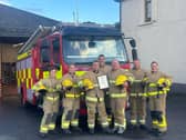 Phil pictured alongside his colleagues at Whitehead Fire Station. (Pic: NIFRS).