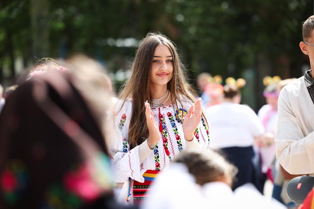 Enjoying the atmosphere of the Belfast Mela Carnival parade.