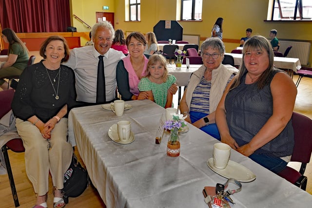 Enjoying the company at the Thomas Street Methodist Youth Fellowship coffee morning are from left, May Porter, Eddie Drury, Eva Hutchinson and daughter Grace (7), Ruth Millar and Gail Lockhart. PT26-207.