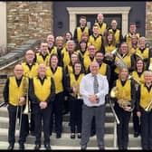 Lisburn band Dynamic Brass celebrates its tenth anniversary with new uniforms