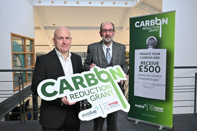 Pictured from left is David Bulter, Director at Evolve, with Terry Waugh, CEO of Action Renewables pictured at the launch of the Carbon Reduction Grant for the Evolve network area. Credit: Submitted