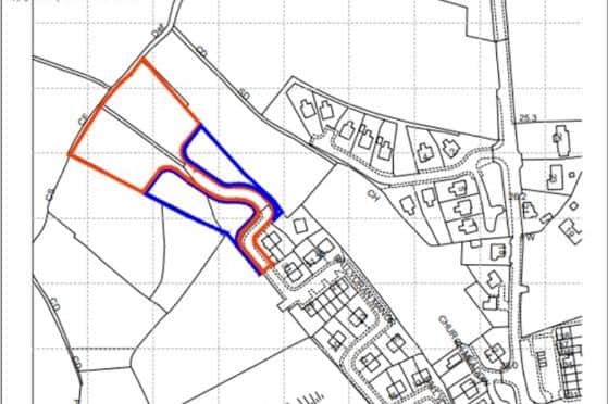 A site map with the proposed development area outlined in red.