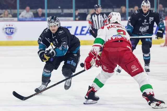 Belfast Giants’ Mike Lee with Cardiff Devils’ Andrew MacWilliam during Wednesday night’s Challenge Cup Final at the SSE Arena, Belfast. Photo by William Cherry/Presseye