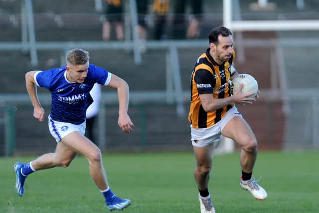 Crossmaglen's Jamie Clarke with Clan's Jamie Brady in tow