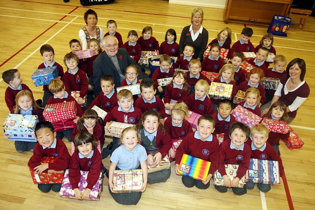 Pupils and staff from Pond Park Primary School pictured in 2007 with shoeboxes filled with gifts for Operation Christmas Child