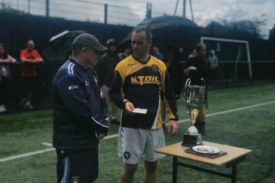 Tony Cochrane (Craigavon City FC) who has played a great role in helping community development, fundraising and reducing deprivation in the Craigavon Area. Here he is with Angela McCabe Cup organiser Frank McCabe.