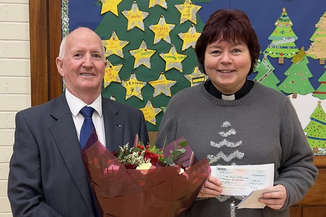 Chairman of the Lisburn and District Masonic Charity Fund, Eddie Carson presented a cheque to Rev Lynne Gibson from St Mark's Church in Lisburn.