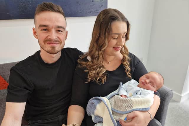 Beautiful baby boy Jonah Burns, with his dad Tyler Burns and Erin McCormac at their new home in Craigavon, Co Armagh which Tyler won in Tommy French Competitions.