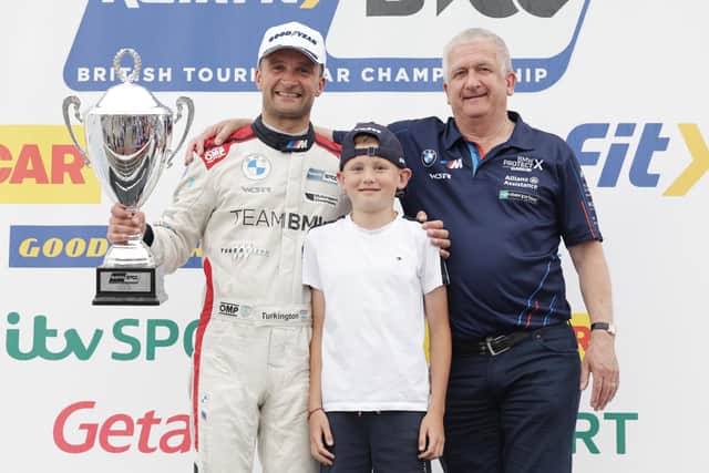 Portadown native Colin Turkington with his father Trevor and nephew Henry. Colin won 2023 British Touring Car Championship – Race 3 at Oulton Park. Picture courtesy of Jakob Ebrey Photography.