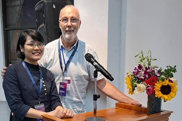 Tommy Barr with compere and translator Duyen Ngoc at the sound-check for Hanoi's International Conference.