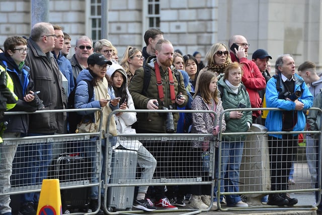 Members of the public hoping to get a glimpse of US President Joe Biden outside the Grand Central Hotel in Belfast. Picture: Arthur Allison/Pacemaker