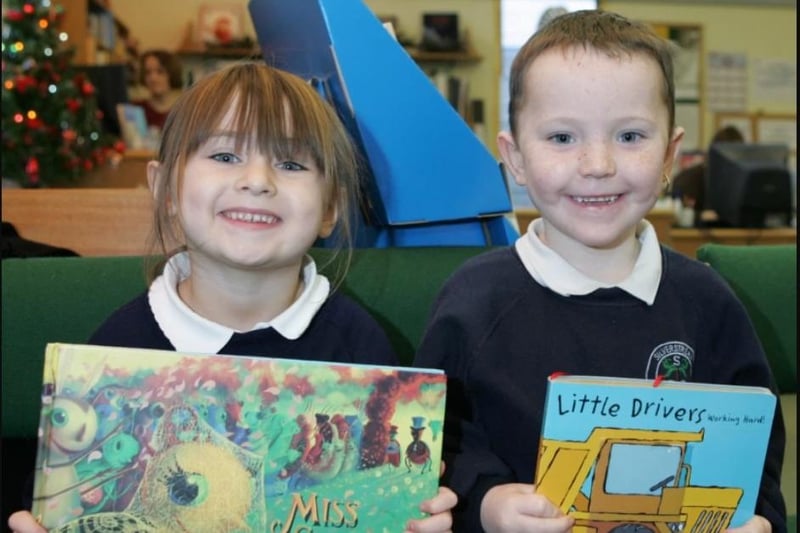 Silverstream Primary School pupils Jamie Beattie and Jocelyn Blair received a Book Trust present when they visited Greenisland Library in 2006.