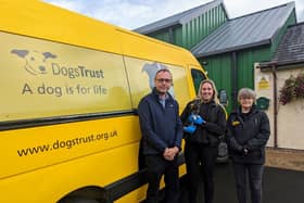 Keith Buchanan is pictured with Sarah Parks Assistant Manager Administration (holding Oscar) and Marbeth Gilmour, Assistant Manager Operations at Ballymena Rehoming Centre.