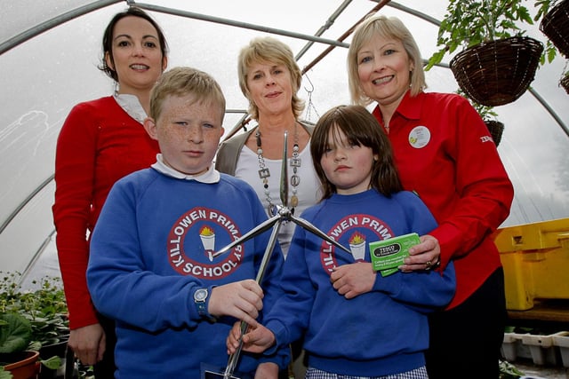 Nicola Chang, from Action Renewables, Fiona Crory, Killowen Primary School, and Anne Broome, from Tesco, pictured with pupils Jason Floyd and Kea Mailey after Killowen won the Tesco Green School of the Year award in 2010