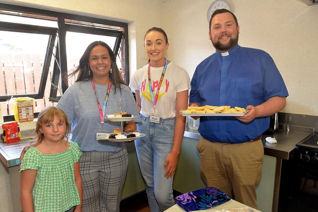 Working behind the scenesin the kitchen at the Thomas Street Methodist Youth Fellowship coffee morning ae from left, Grace Henderson (8), Adrianna Thompson, Ruth Willis and Rev Darrin Thompson. PT26-215.