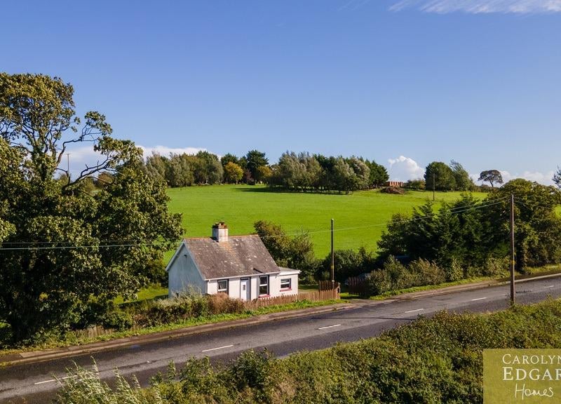 Set on a large private site of approximately 0.7 acres, surrounded by picturesque countryside and enjoying an idyllic setting, this charming former labourer's cottage dates back almost 100 years. The property is set in wraparound gardens and offers plenty of outdoor space for those looking to enjoy a more rural lifestyle with ample room for hobbies, gardening and outdoor projects. Internally, the property offers deceptively bright and spacious accommodation, with high ceilings adding to the feeling of space throughout and many of the original features. The open-plan living room features an exposed brick fireplace with woodburning stove and opens onto a well-equipped kitchen with an ample range of built in units and appliances. There are two double bedrooms, with the principal bedroom benefiting from a walk-in dressing area, and a separate bathroom.. Externally, the property sits within a large, mature site, surrounded by trees and with a generous parking area suitable for several cars. It is on the market for offers in the region of £235,000 with Carolyn Edgar Homes.