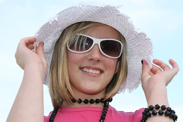 HAT AND SHADES...Amy Murray smiles for the camera during the Red Sails Festival fancy dress parade in Portstewart in 2008. Credit: NI World