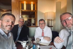 A selfie of Robbie Butler, UUP MLA, Gavin Robinson, DUP MP, Sir Jeffrey Donaldson MP, DUP leader, and UUP leader Doug Beattie MLA enjoying coffee.