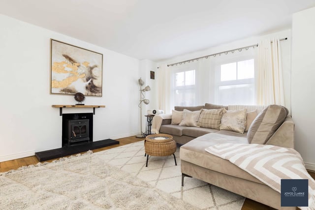 The living room has a front aspect and a wood burning stove with tiled hearth for cosy evenings in.  The attractively decorated room is set off beautifully with a solid oak herringbone floor.