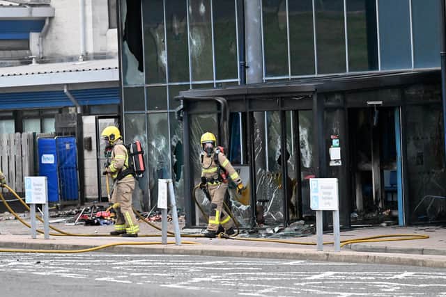 Firefighters at Larne leisure centre after it was set alight in June of last year. Photo: PressEye