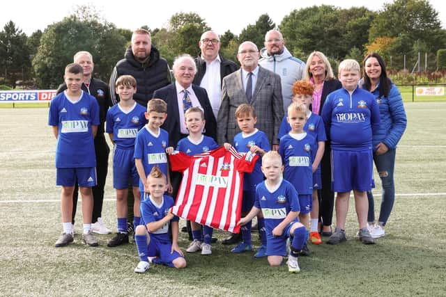 Chris Finlay, Ryan Ellis, Michelle Wood and Neil Woolsey (Ballymacash Rangers) alongside Ald Amanda Grehan, Dr Terry Cross OBE and Greg Prescott (Biopax Limited) and Bill Shaw from the David Cross Foundation with some of the young football players. (Pic Press Eye).