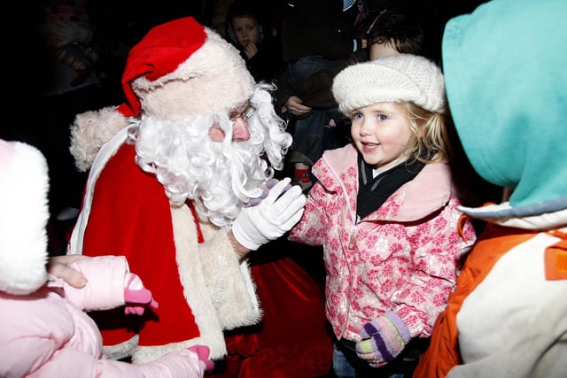 This little girl meets Santa during the switch on of the Christmas Lights in Portstewart in 2009