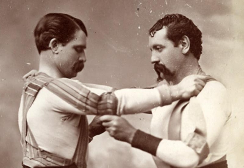 Similar to ‘Cornish Wrassling’, which was popular in places like Cornwall and Brittany, Celtic wrestling or collar-and-elbow wrestling was an adaptation of this with rural Northern Irish communities utilising the sport during local gatherings. Celtic wrestling consisted of participants showcasing their strength, balance and skill during a series of grappling matches. The sport dates back to ancient times with the first mention of it appearing in the ancient book of Leinster. The book described Celtic wrestling being included in the Tailteann Games which date back to 1829 BC. This sport also became popular in some regions overseas, such as Australia and America, which saw a lot of Irish immigration. Grappling matches such as these are a lot less popular today and are not a rural community activity like they had been many years ago.