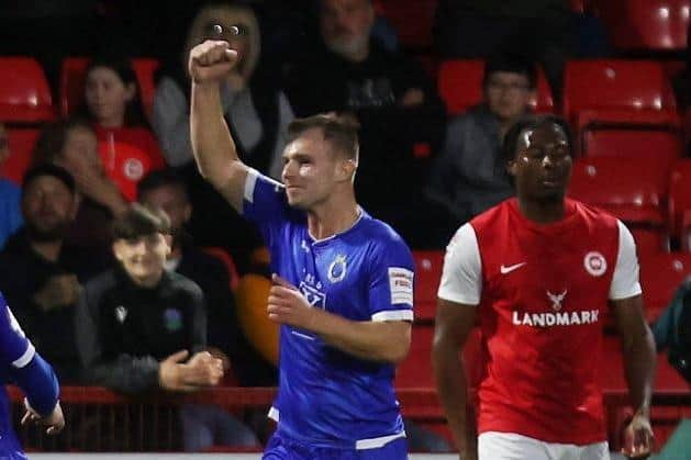 Andrew Whiteside celebrates scoring Dungannon's stoppage time equaliser. (Colm Lenaghan/Pacemaker Press).