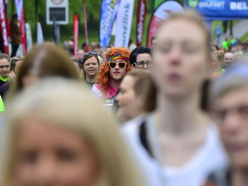 A colourful runner stands out in the crowd.
