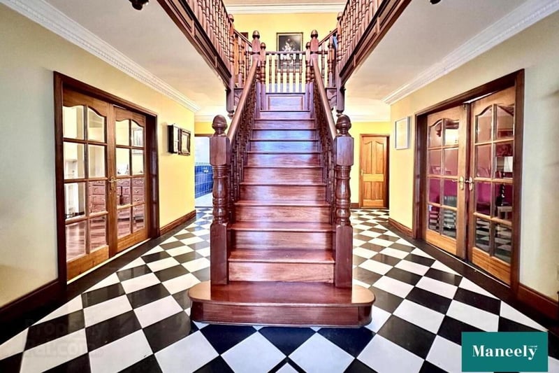 Reception hall with mahogany feature gallery staircase.
