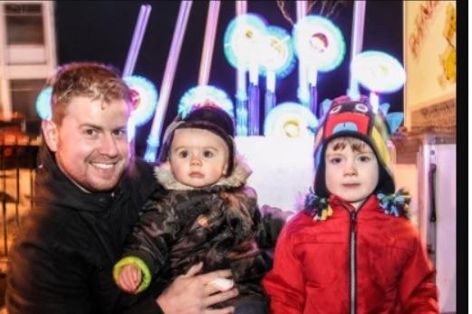Joey and Jake enjoying the fun at the 2014 Ballyclare lights switch on with dad, Johnny.
