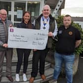 Charity auction organisers present the cheque to ​Alison Donaghy from the Southern Area Hospice.