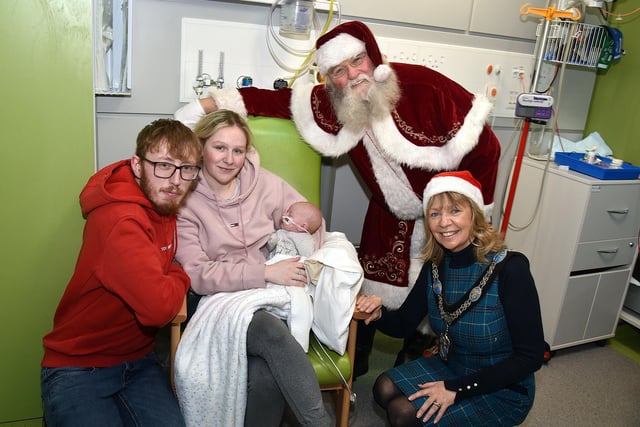 New parents, Jack Lunn and Melanie Lucas with their four-week-old daughter Hailey pictured with Santa and Lord Mayor of ABC Council, Alderman Margaret Tinsley during the mayoral visit to the Blossom Unit.