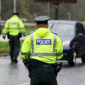 General image of police officers conducting a vehicle checkpoint. Picture: Press Eye