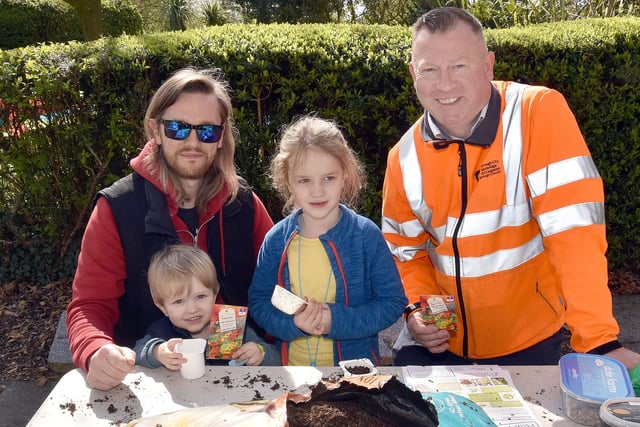 Taking part in some flower seed planting at the Tannaghmore Gardens Fun Day are Stuart McKinley and children, Magnus (3) and Juiletta (6) wuth Dominic Marsden, ABC Council Recycling Inspector. PT15-208.