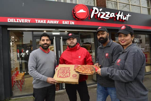 From left owner Sandeep Sharma, delivery driver Janos Dunaujvaros, pizza chef Preetham and general manager Bhavishya Chauhan