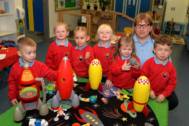 Millington Nursery School principal Tanya Millar joins in playtime with pupils from left, Jack, Elsie, Kamile, Willow, Poppy and Charlie. PT41-332.