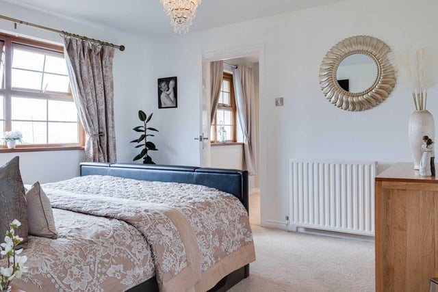 Spacious master bedroom with far-reaching views over Larne Lough.