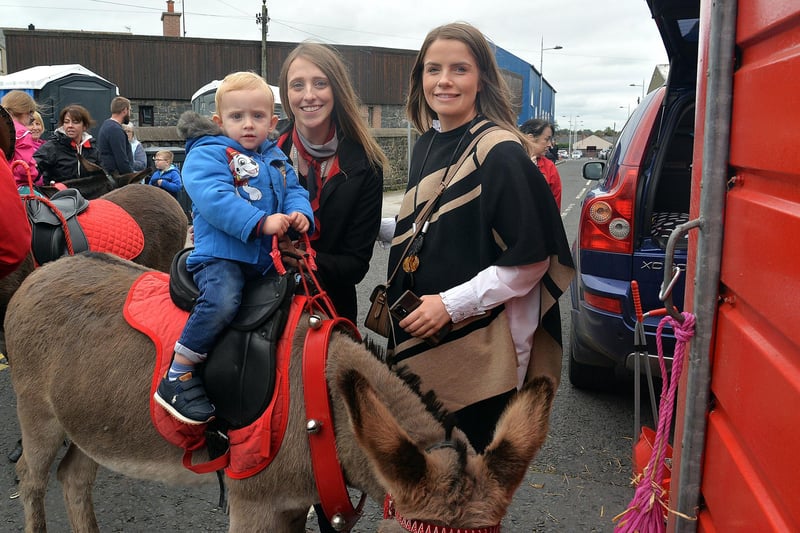 Ezra Walker (1) looks excited to be having a donkey ride at Country Comes To Town with mum, Bethany and aunt, Rachel Irwin. PT38-216.