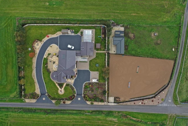 An aerial view of 3 Derrycor Road, Portadown - a fabulous four-bedroom family home with extensive outdoor space, including stable block, sand area and paddock.