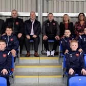 Pictured are Brian Sofley, Managing Director, ASSA ABLOY, Chris Budd, Director of the Lisburn Castlereagh Junior Football League, Andy Tough, Chief Executive, Inspire Business Centre, Chris Finlay, Head Coach, Alderman Amanda Grehan, Janet Little, Boomer Industries, and some of the young players.