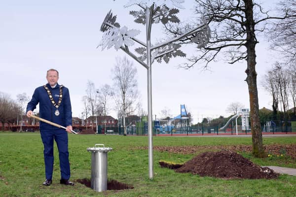 Mayor of Antrim and Newtownabbey, Ald Stephen Ross, with the time capsule at Lilian Bland Community Park, Glengormley.