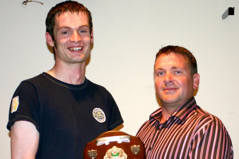 Alan Workman from Taverners FC who won the Merit Award at the club's annual dinner in the Bush Tavern in 2008. Pictured handing over the award is manager, Gary Lyttle